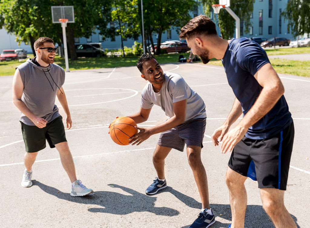 three young men playing basketball and kept up with their sport physicals dallas texas