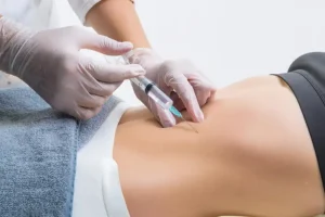 Simply Direct Medicine—A doctor’s hands administer an injection of Semaglutide to a patient to help with weight loss in an office in Farmers Branch, TX.